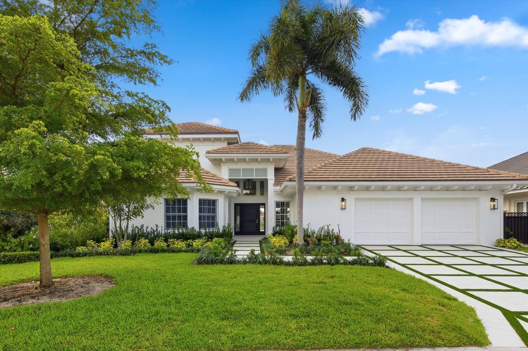 Welcome to this extensively renovated lakefront residence in The Loxahatchee Club, Jupiter's premier private golf community.