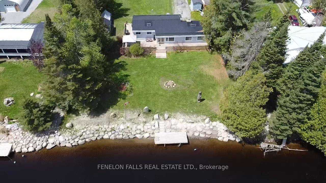 This spacious bungalow with wrap around deck on the Burnt River has never had damage from spring floods in the 25 years these owners have lived here !