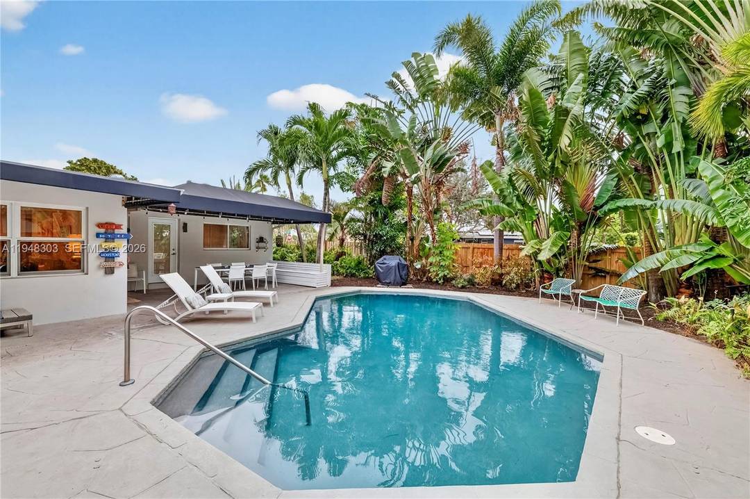 Impeccable 3 Bedroom, 3 Bath residence featuring two elegant primary suites, each with direct access to the poolside retreat.