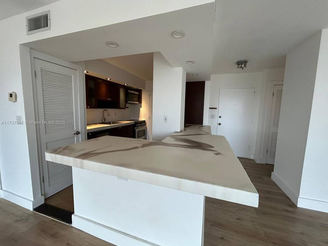 LUXURY STATE OF THE ARTS APARTMENT WITH TOUCHES OF PICASSO, UNBELIEVABLE VIEWS, KITCHEN COMPLETELY REMODELED WITH BRAND NEW COUNTER TOPS, SPACIOUS APARTMENT WITH IMPACT HURRICANE WINDOWS INSTALLED 2024, NOT A ...