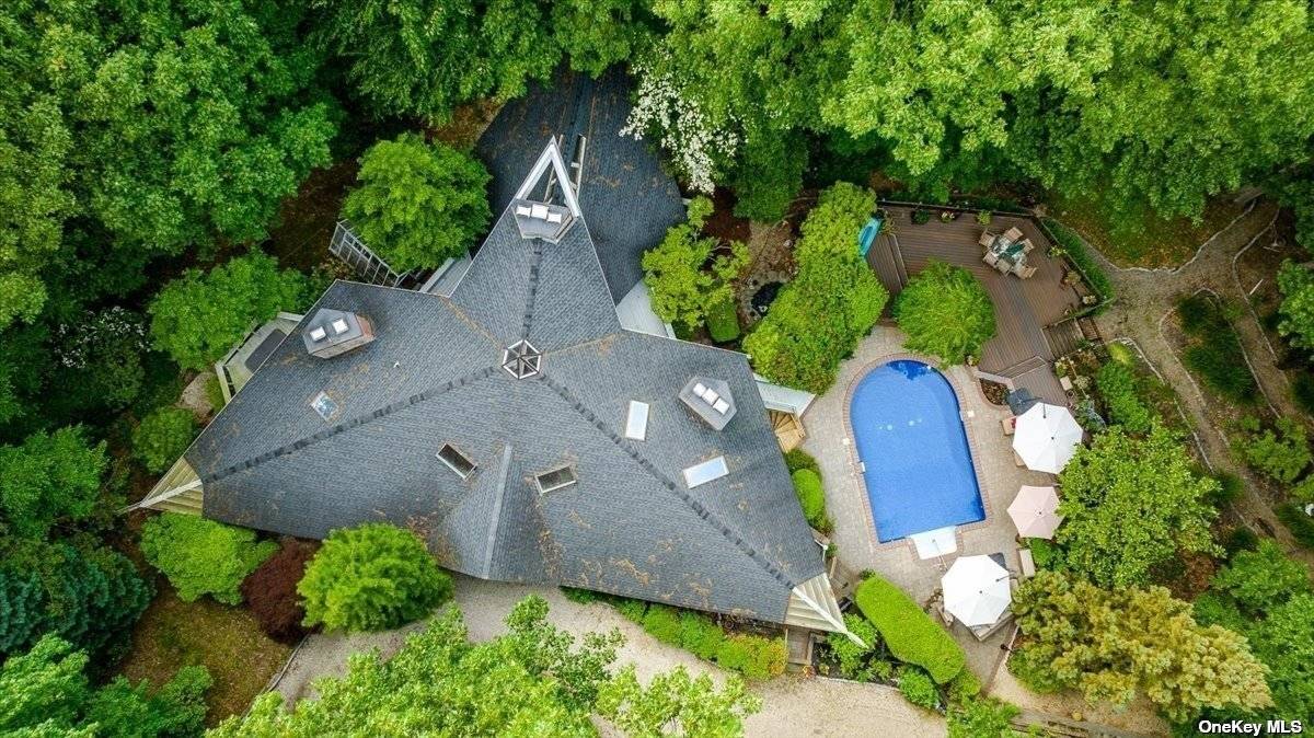 Frank Lloyd Wright disciple and follower, Roy Sigvard Johnson, designed this incredibly unique home nestled in the property and completely private.