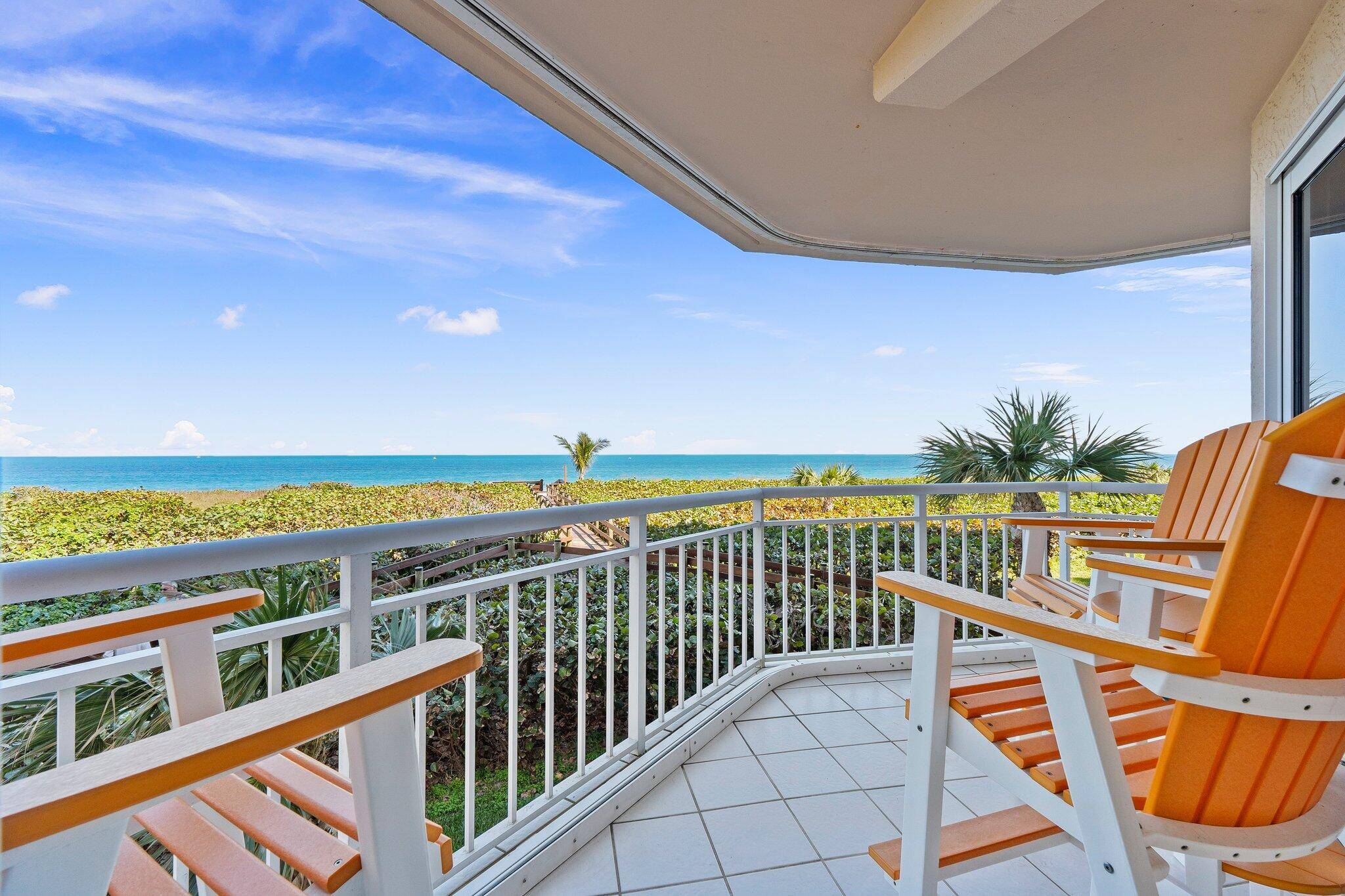 Enjoy breathtaking views from this exquisite corner unit just steps from ocean with two private balconies.