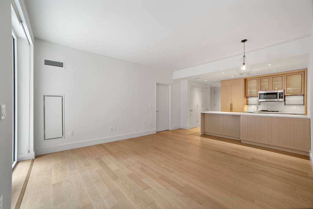 Residence 203 features oversized windows, generous closets, and a garden backyard.