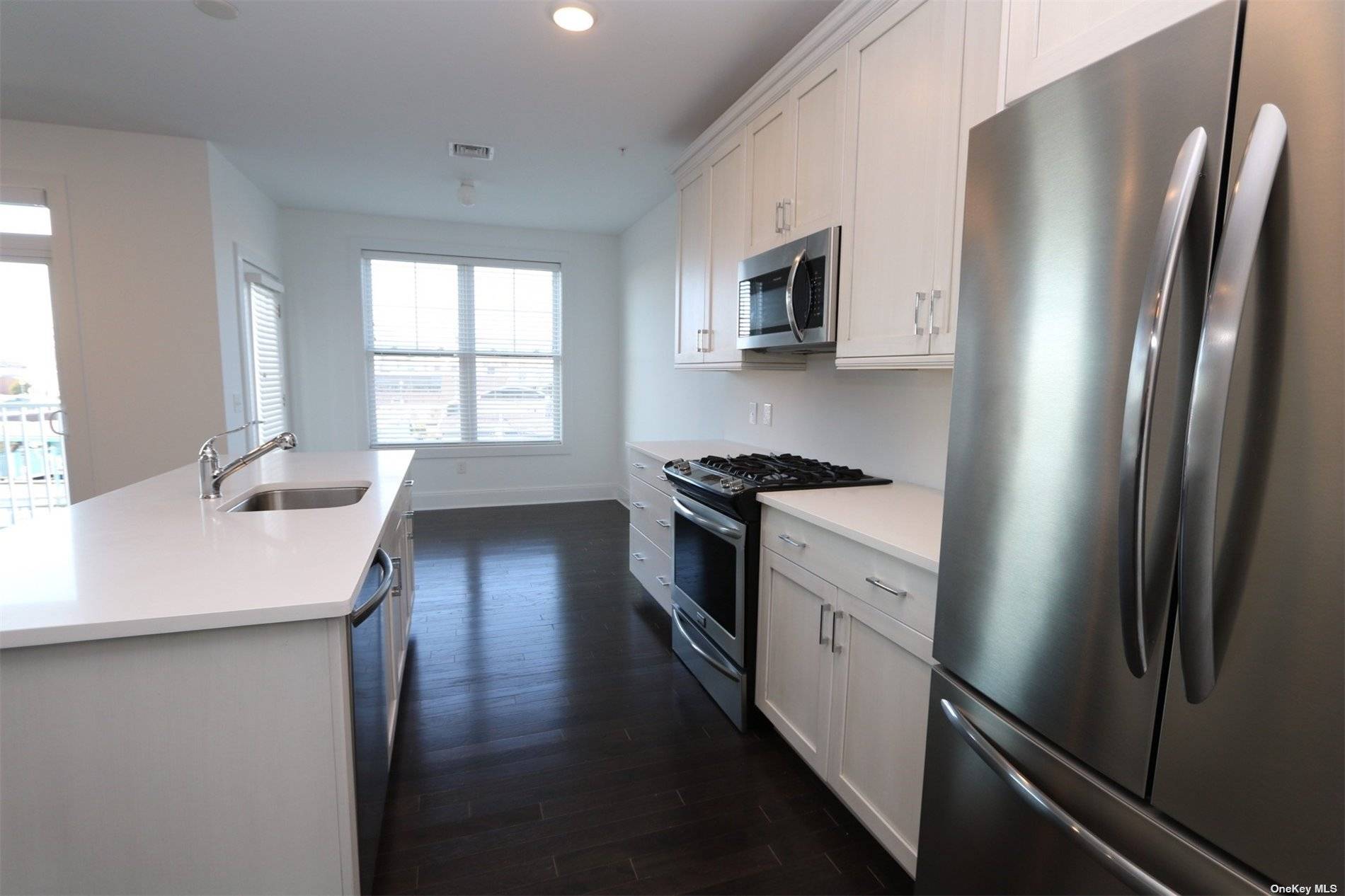 Bright and sunny corner unit with water views !