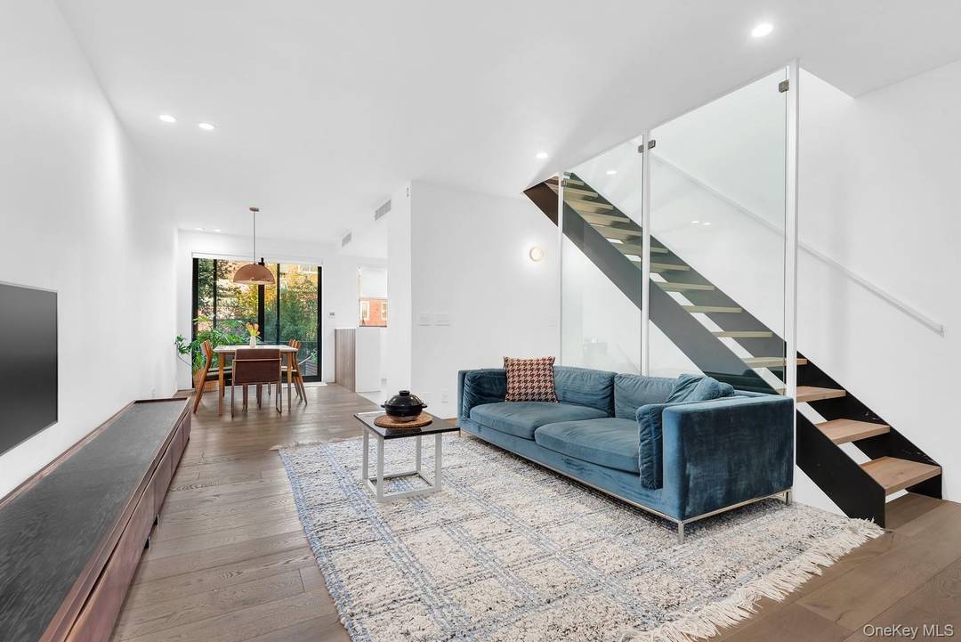 MODERN MOVE IN READY ! Welcome to this stunning and completely renovated 2 Family residence featuring three bedrooms and three and a half baths, designed with modern and sleek finishes ...