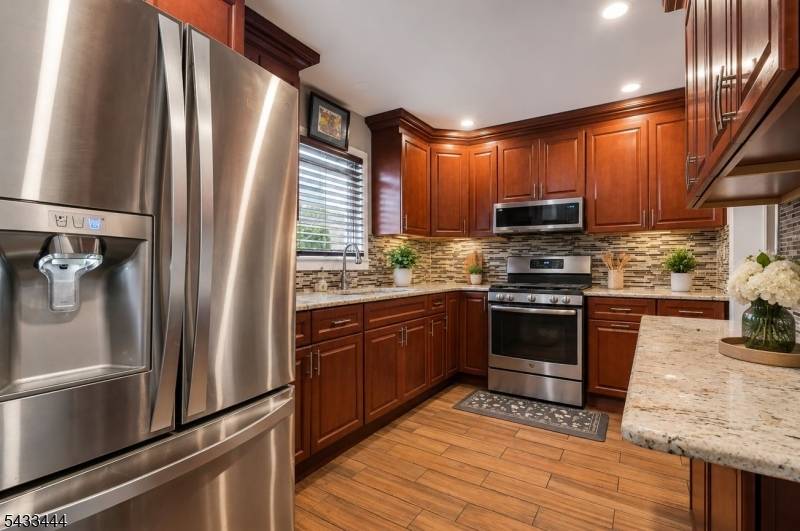 Well maintained 2 family home offering 5 Brs and 3 full Bths, ideal for owner occupants or investors.
