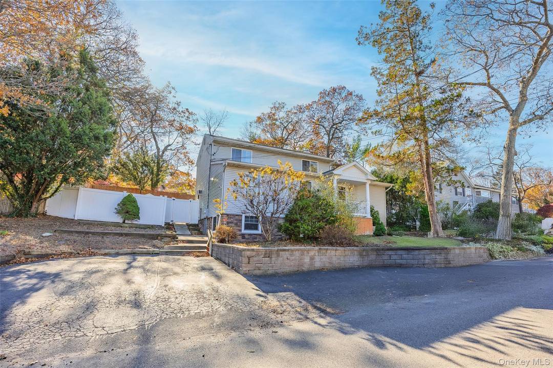 Rare Opportunity to Own a Huge Colonial and Experience Beach Living with the Long Island Sound just two blocks away Featuring a Front Stone Elevation Newer Vinyl Siding Under Soffit ...