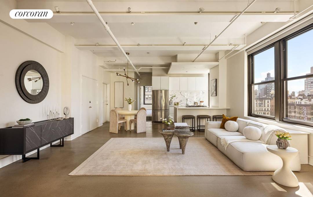 Perched on a high floor in a boutique Nomad cooperative, this designer two bedroom, two bathroom pre war loft seamlessly blends classic loft aesthetic with modern finishes.