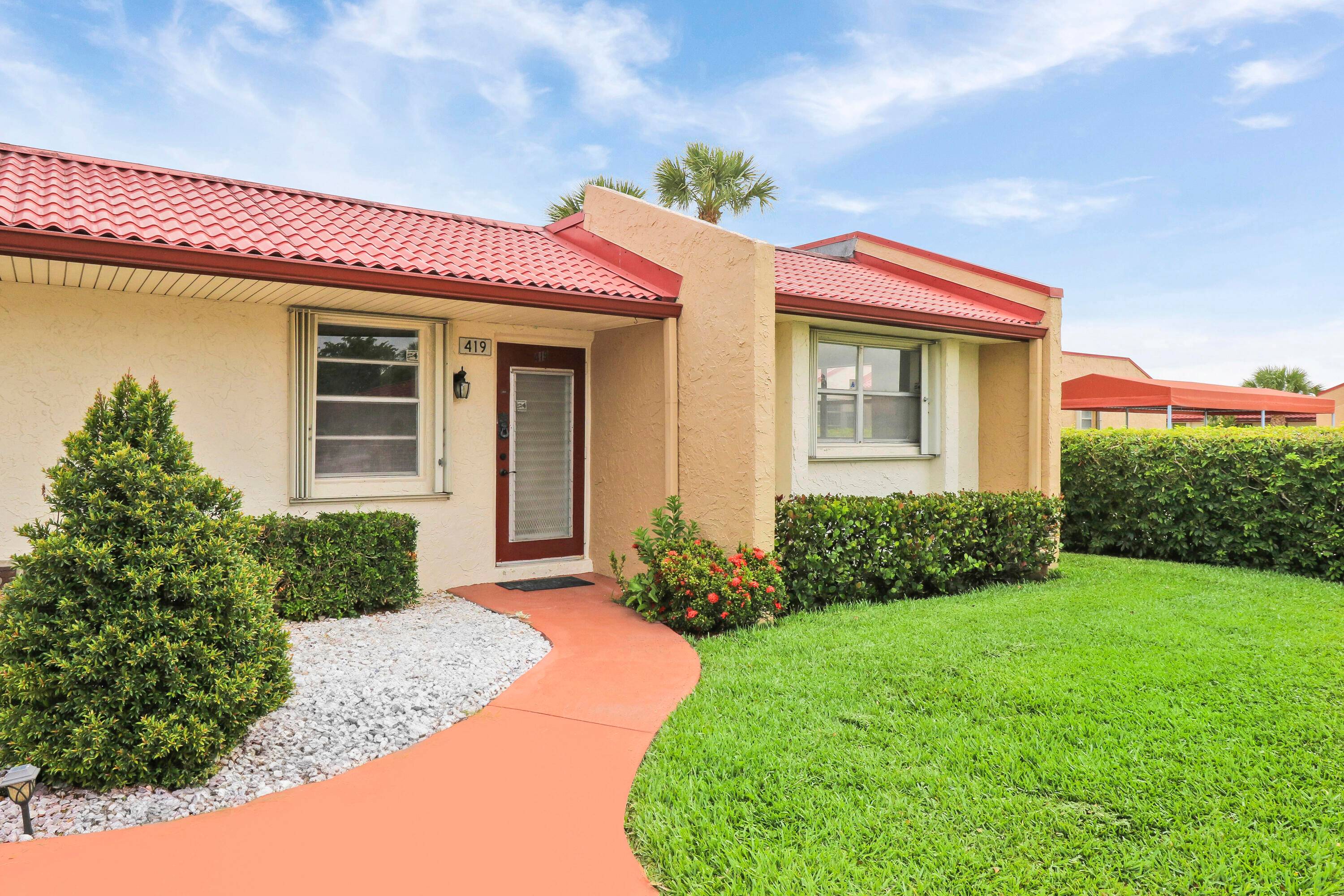 Welcome to 419 Lake Carol in the desirable Golden Lakes Village of West Palm Beach !