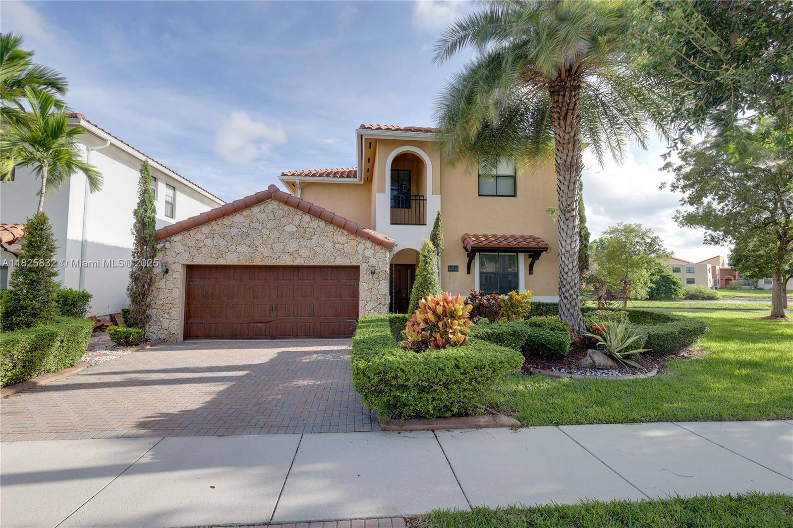 Stunning corner lot home built in 2012, featuring modern design, impact windows doors, and a spacious open concept layout.