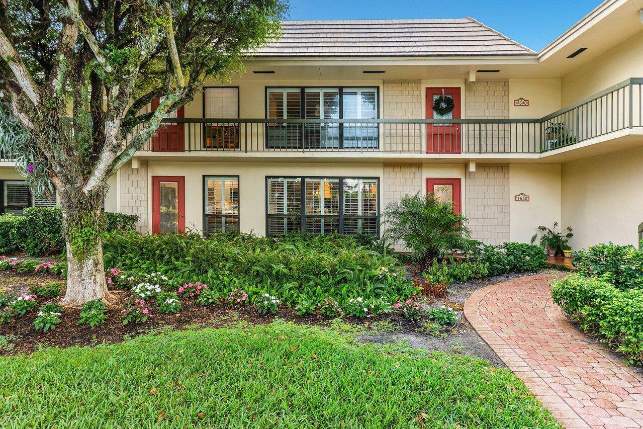 Nestled in a serene private club community, this updated first floor residence offers effortless charm and functionality.