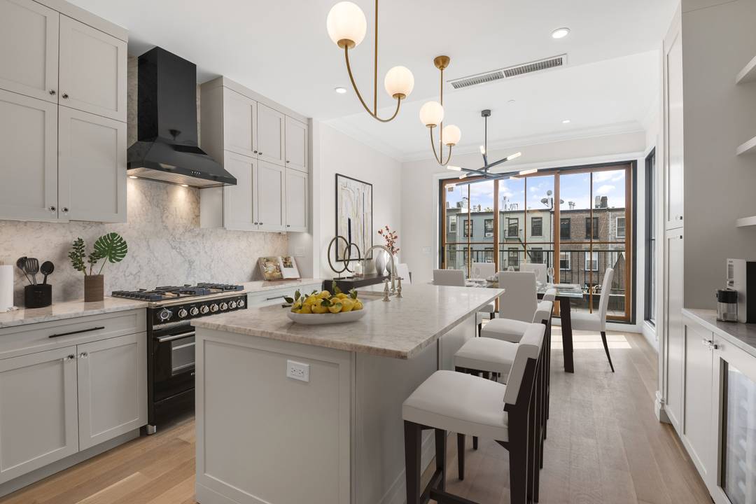 Welcome home to this stunning Carroll Gardens floor through three bedroom, two and a half bathroom residence with TWO unique private outdoor spaces, a terrace off the dining room and ...