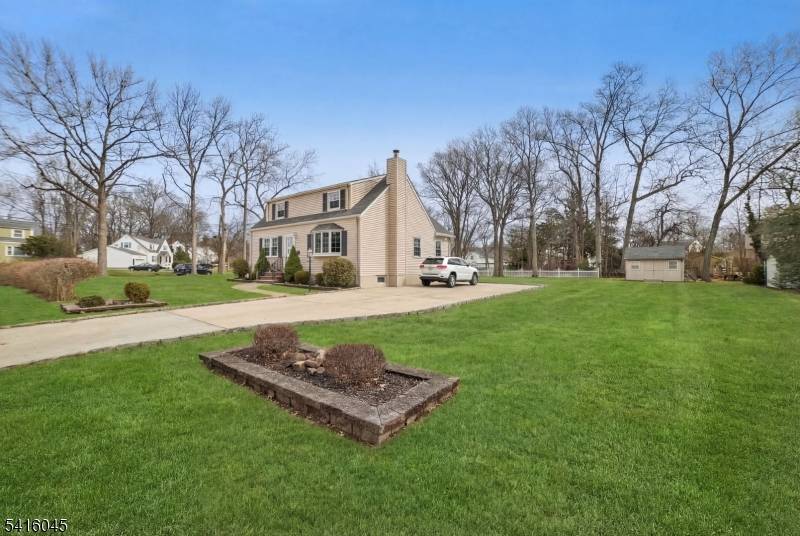 Charming Cape Cod set on a double sized corner lot in the heart of Fanwood, offering timeless character, bright living spaces, and exceptional pride of ownership.