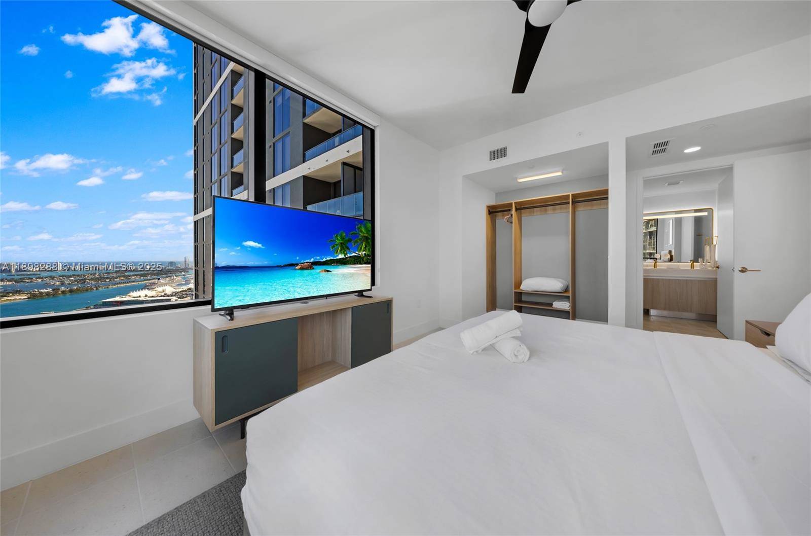 Perched on the 42nd floor, this corner residence captures sweeping views of Biscayne Bay, the Miami skyline, and Miami Worldcenter.