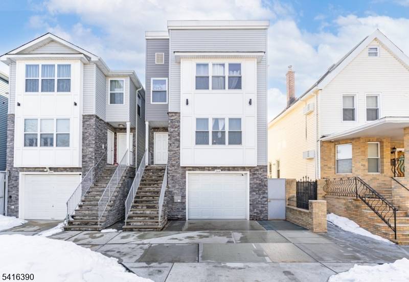 NEWLY BUILT, UNIQUE two family featuring a rare ground level unit with 2 rooms and a full bath, home office, or added flexibility.