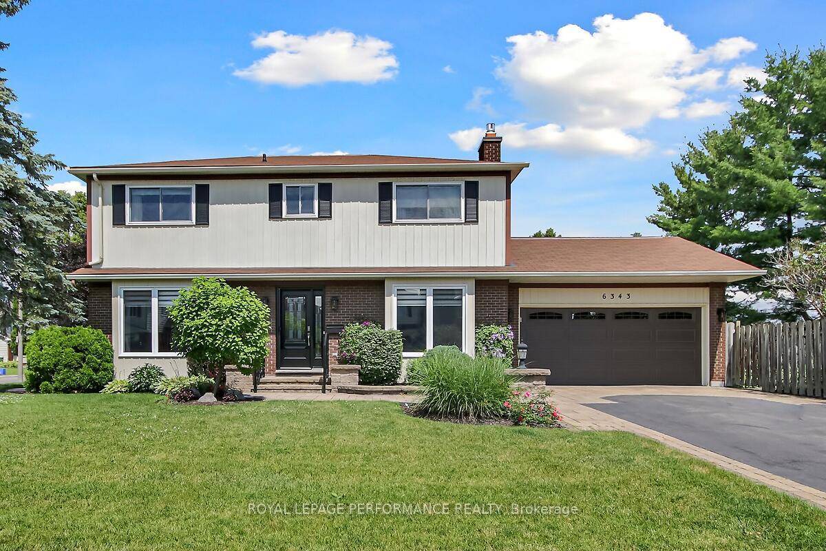 On a beautifully landscaped corner lot in a family oriented neighbourhood, close to all amenities, 6343 Viseneau Dr.