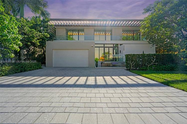 Introducing a rare ultra luxury waterfront home within the gated Eastern Shores community.