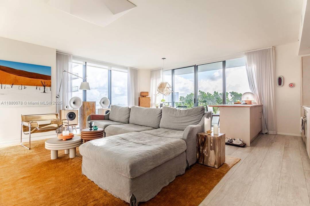 Perched on a high floor at Hyde Midtown, this fully renovated corner residence pairs unobstructed bay views with refined custom interiors and true move in ready ease.