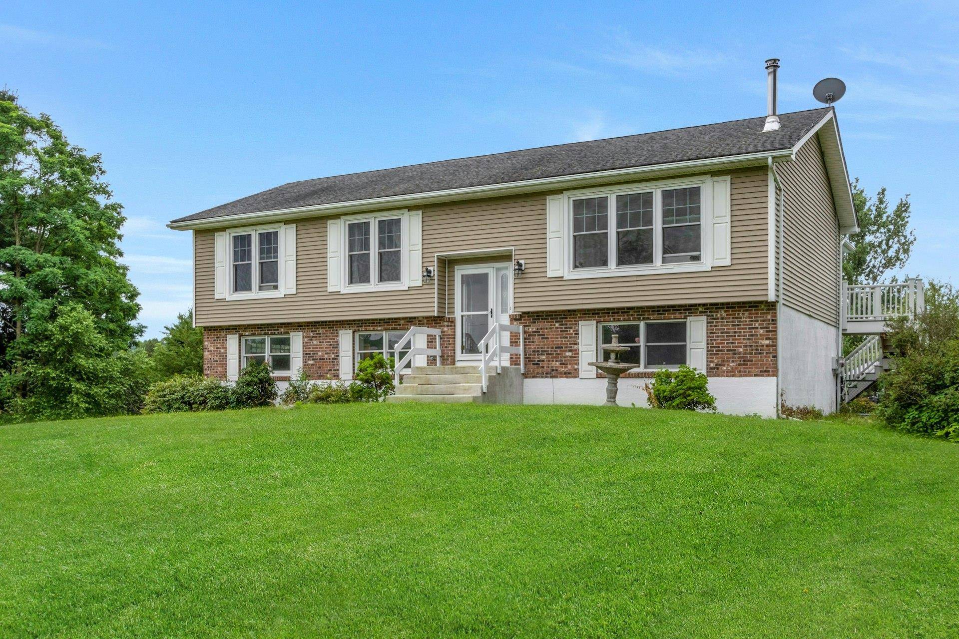 Set on 2. 2 scenic acres, this spacious Raised Ranch offers a perfect blend of comfort and versatility.