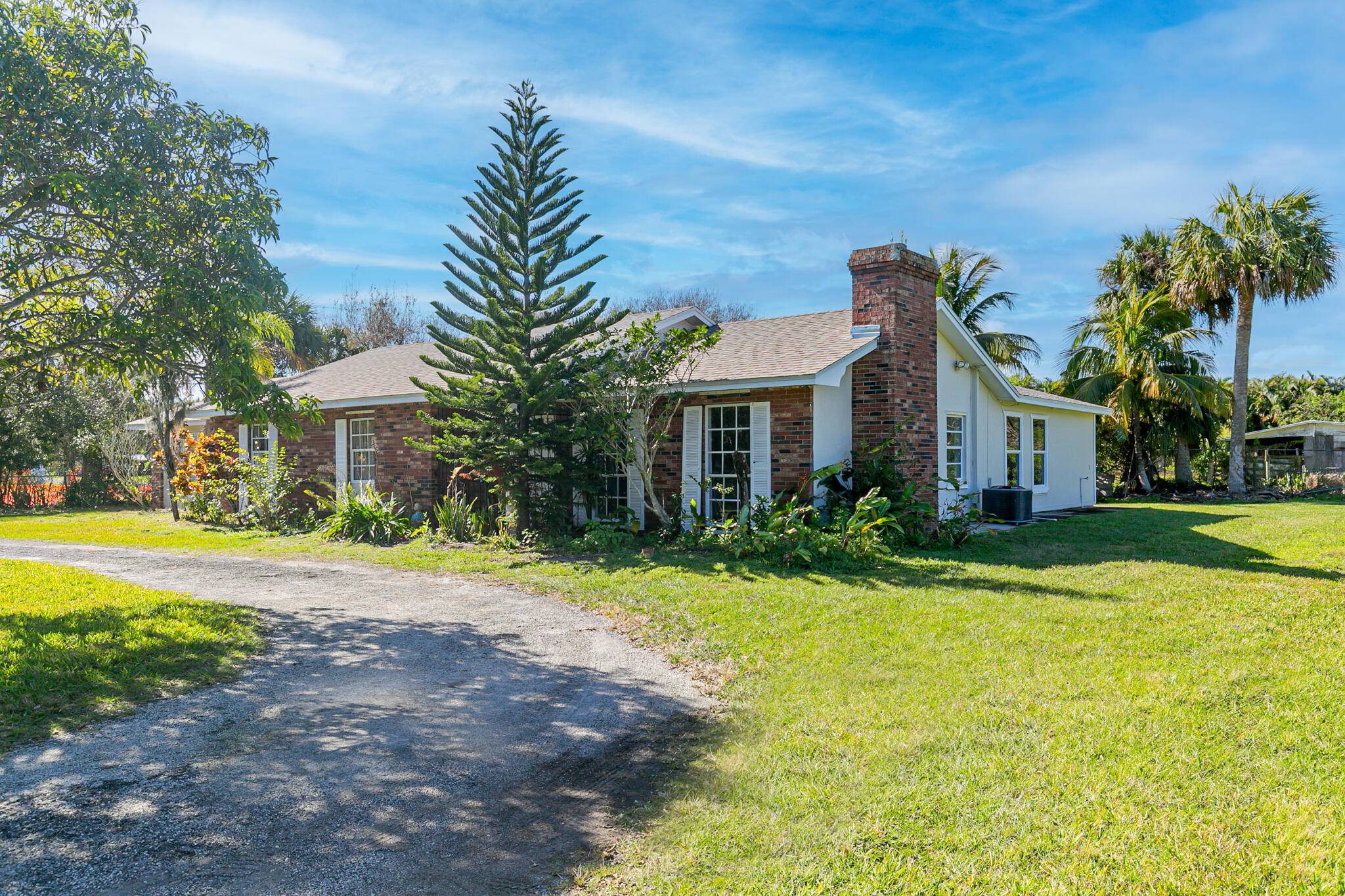 Old Florida charm, a rare find, tucked away with private oasis on over 2 acres of land.