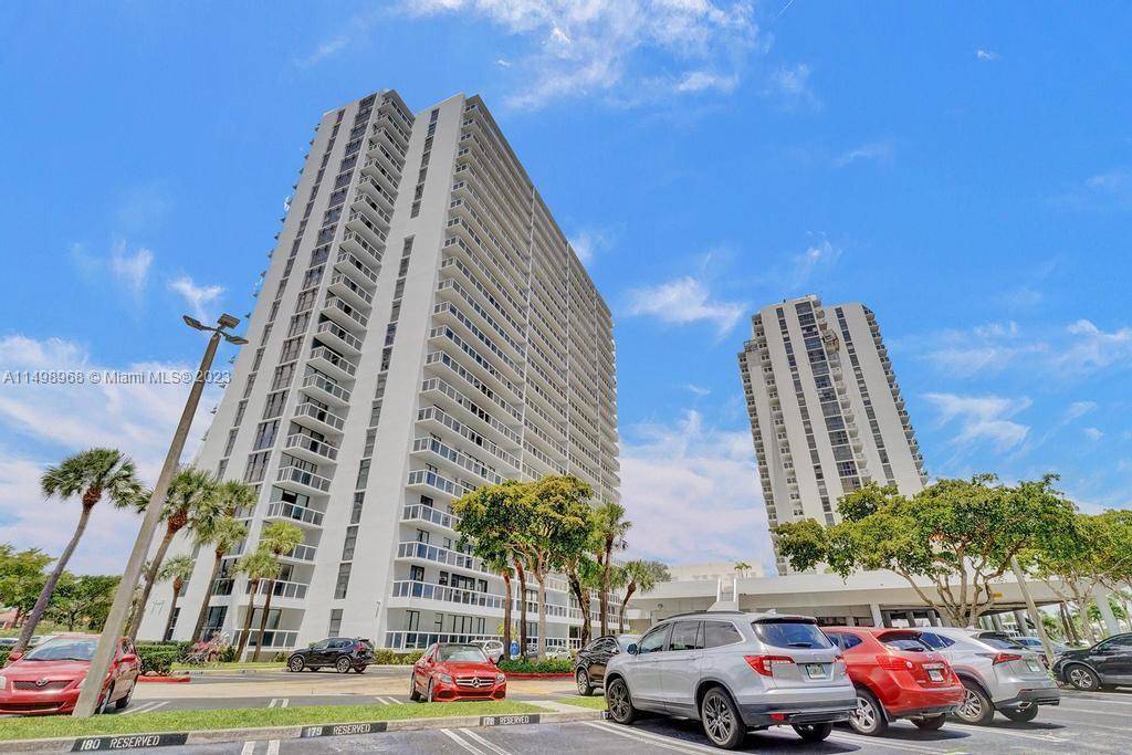 Waterview condo on coveted Country Club Dr features an intracoastal view, split floor plan, and huge terrace accessed by each room.