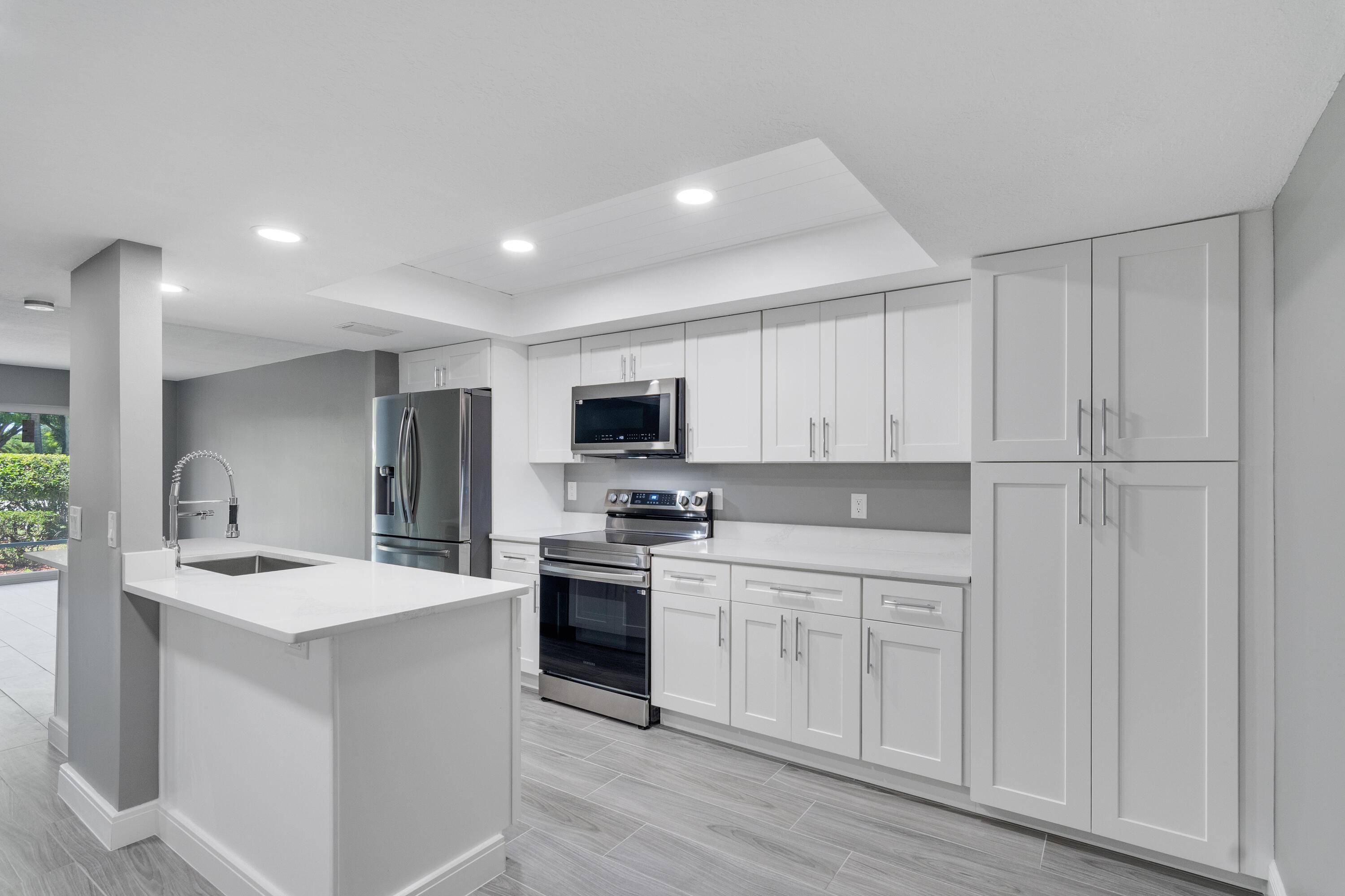 LIVE BY THE BEACH IN THIS TURN KEY LUXURY CONDO ; COMPLETE WITH NEW TOP OF THE LINE STAINLESS STEEL APPLIANCES, WASHER DRYER, WHITE SHAKER KITCHEN CABINETS SELF CLOSING DRAWS ...