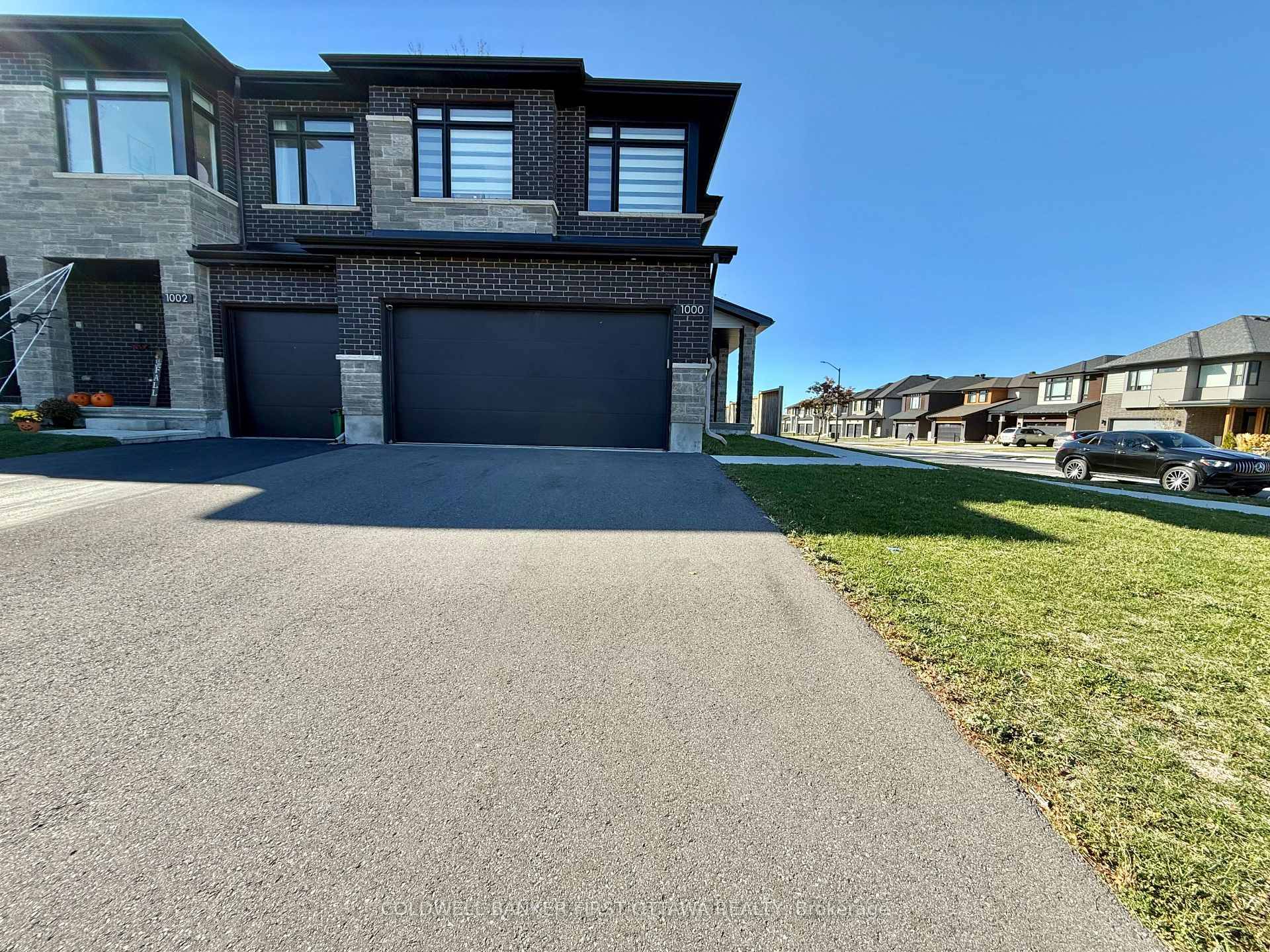 Presenting a meticulously maintained Richcraft Sonoma model end unit townhouse, ideally situated on a desirable corner lot with a double garage.