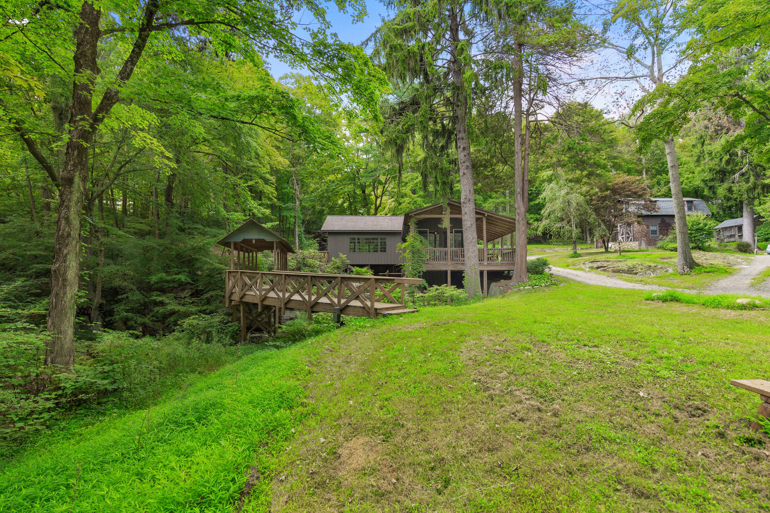 Discover tranquility at this one of a kind mini estate set on nearly 4 acres, where natural beauty meets refined living.