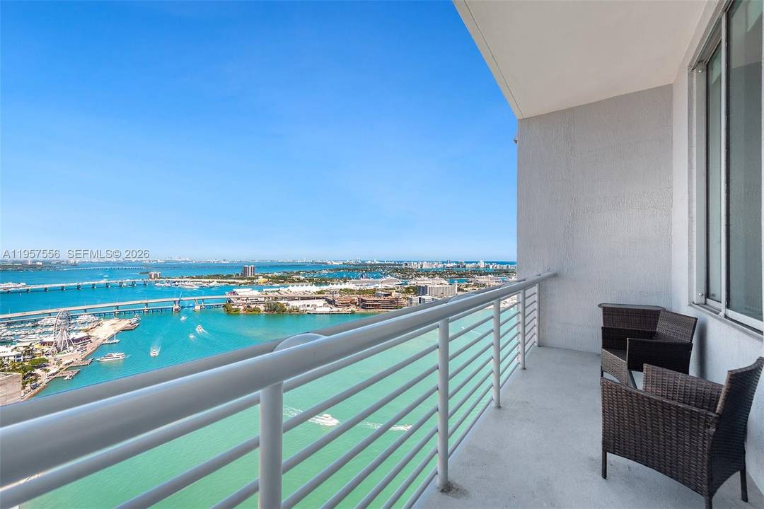 A stylish PENTHOUSE with dramatic 12 foot ceilings delivering breathtaking views of Biscayne Bay, Miami Beach and Port of Miami.