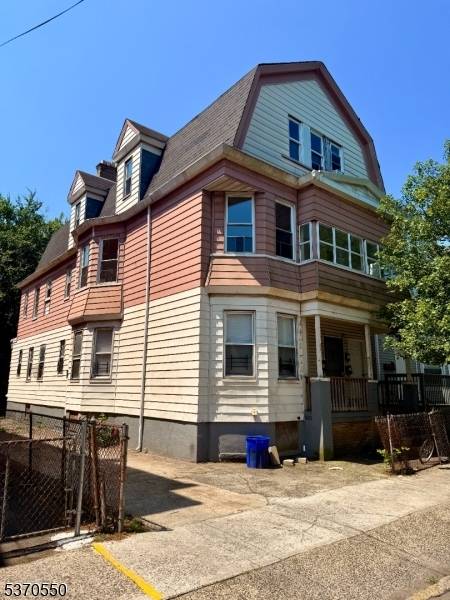 Spacious 5, 100 sq ft three family home offering incredible space and income potential.