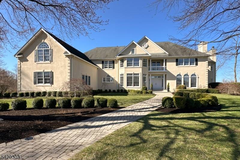 Anchoring a picturesque cul de sac in an estate style Montgomery Township enclave, this striking home is defined by soaring ceiling heights and a luminous, all white palette that amplifies ...