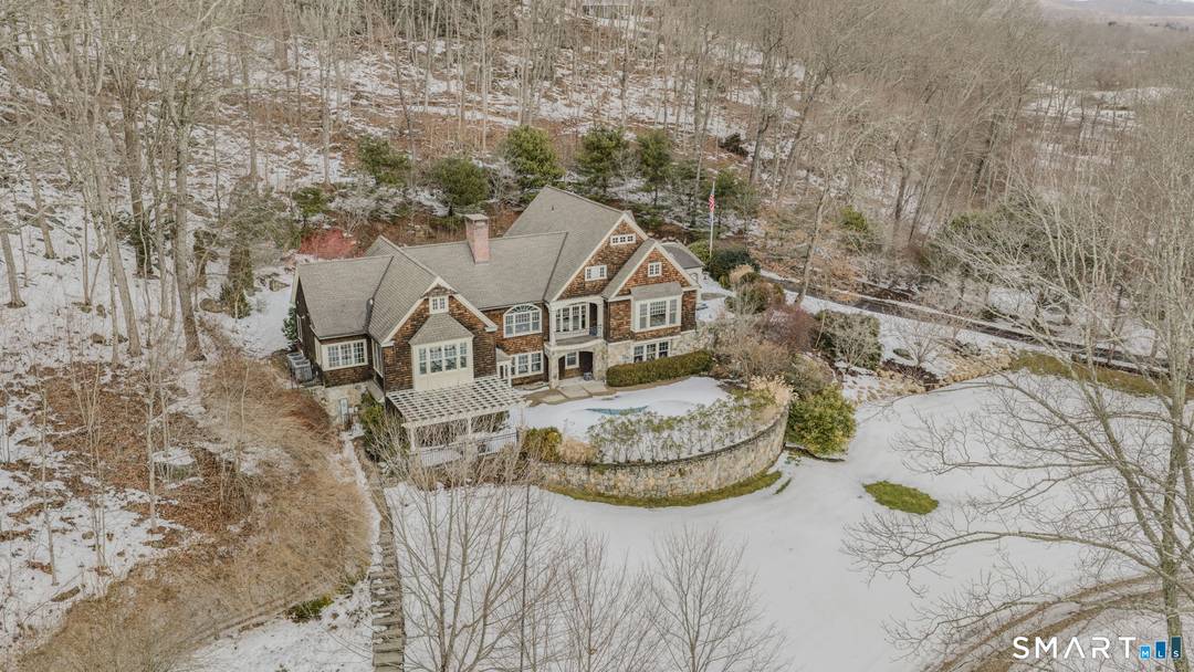 Amazing custom built Nantucket style Cape situated on sprawling grounds, terraced high above a picturesque great yard overseen by natural highlands.