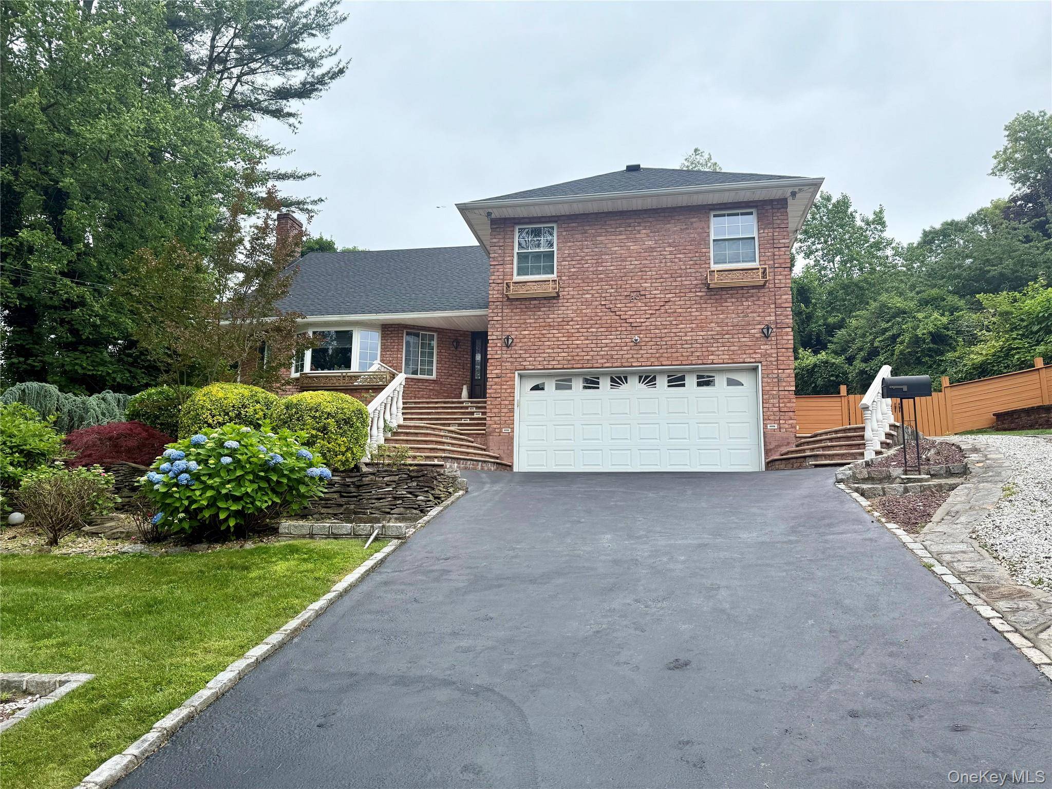 Welcome to this stunning split level brick home with a brand new roof and open kitchen with bright multi level layout featuring hardwood floors.