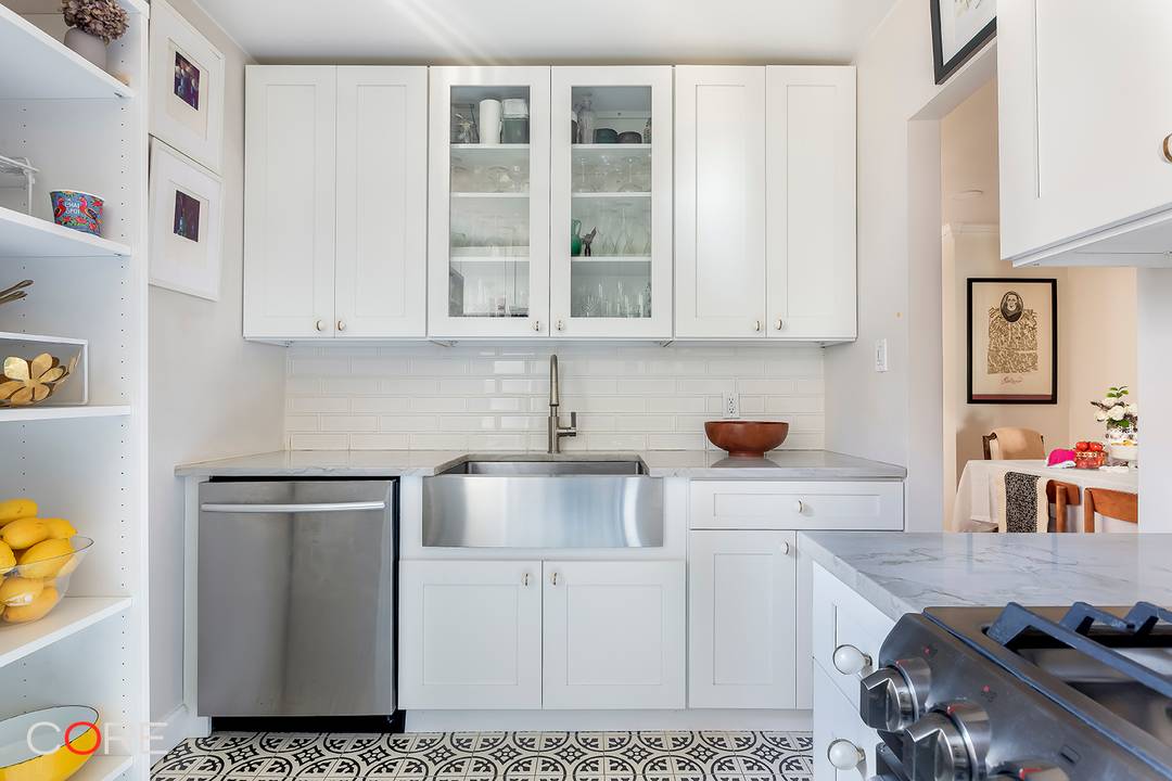 Quiet Luxury in a Fully Renovated Top Floor Corner Unit.