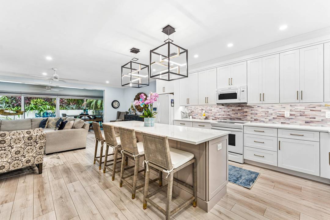 Rarely available townhome located in a gated community of just 6 residences on the corner of George Bush Blvd and A1A.