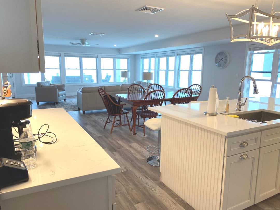 This updated 2021 beach house offers a tranquil escape on the Long Island Sound, providing direct beach access for immediate enjoyment of the waterfront.