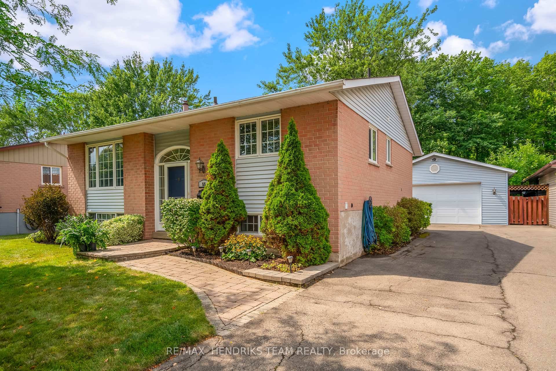 Hard to find yet here it is an immaculately kept home backing onto wooded parklands that comes with a huge double detached garage !