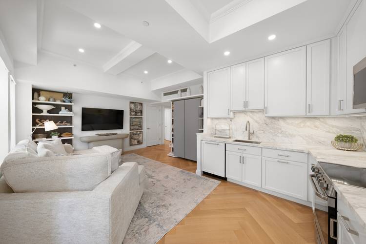 Welcome to Residence 1817 at the iconic JW Marriott Essex House, a beautifully reimagined one bedroom, two bathroom home offering an elegant blend of classic charm and modern luxury.