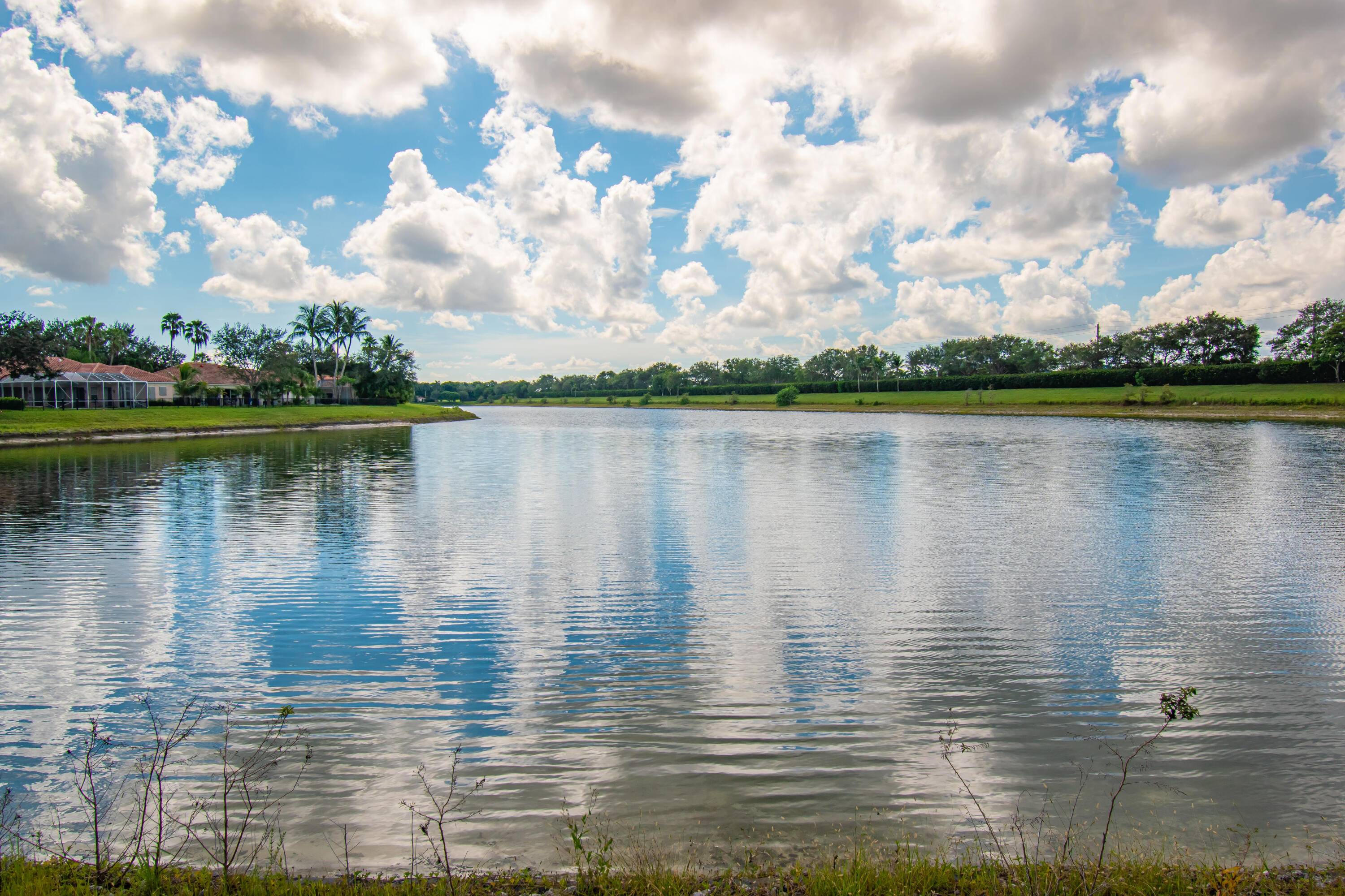 Long Lake View with Private Screened Patio DiVosta Signature Community Whirlpool Appliances Custom Window Treatments Poured reinforced concrete const, New Roof, Washer Dryer 2024 A C aprox 4 years old ...