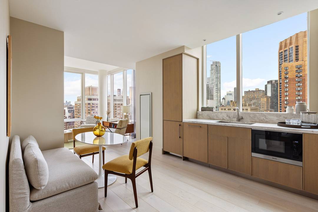 An Expansive Corner 2 Bedroom Home Office with Iconic Skyline Views !