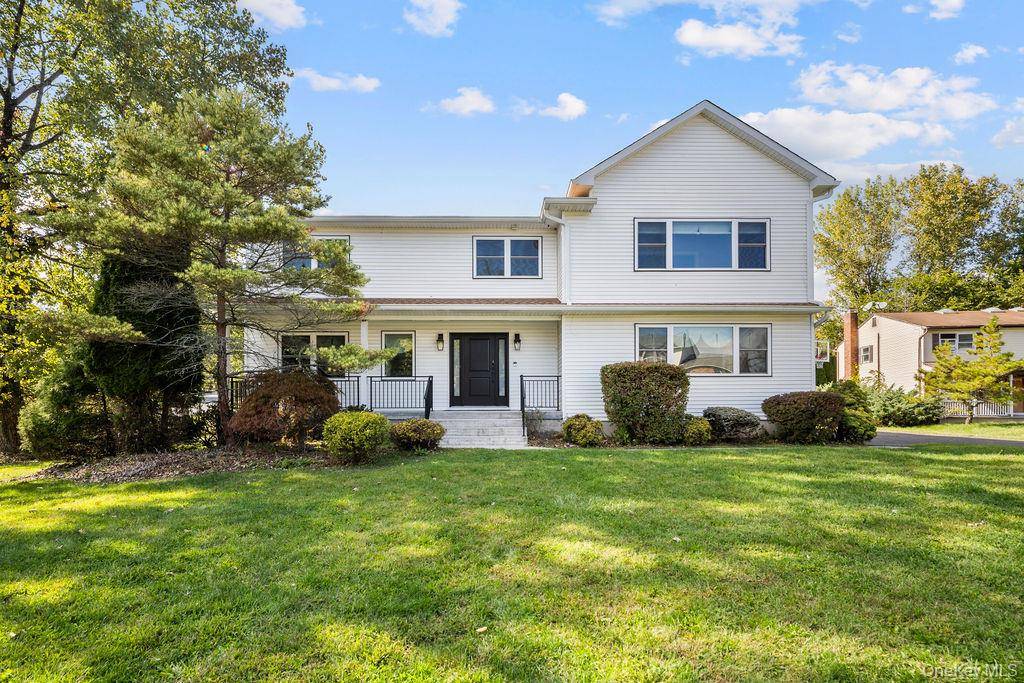 Experience the pinnacle of luxury living in this regal 12 room Colonial nestled on a serene Spring Valley cul de sac.