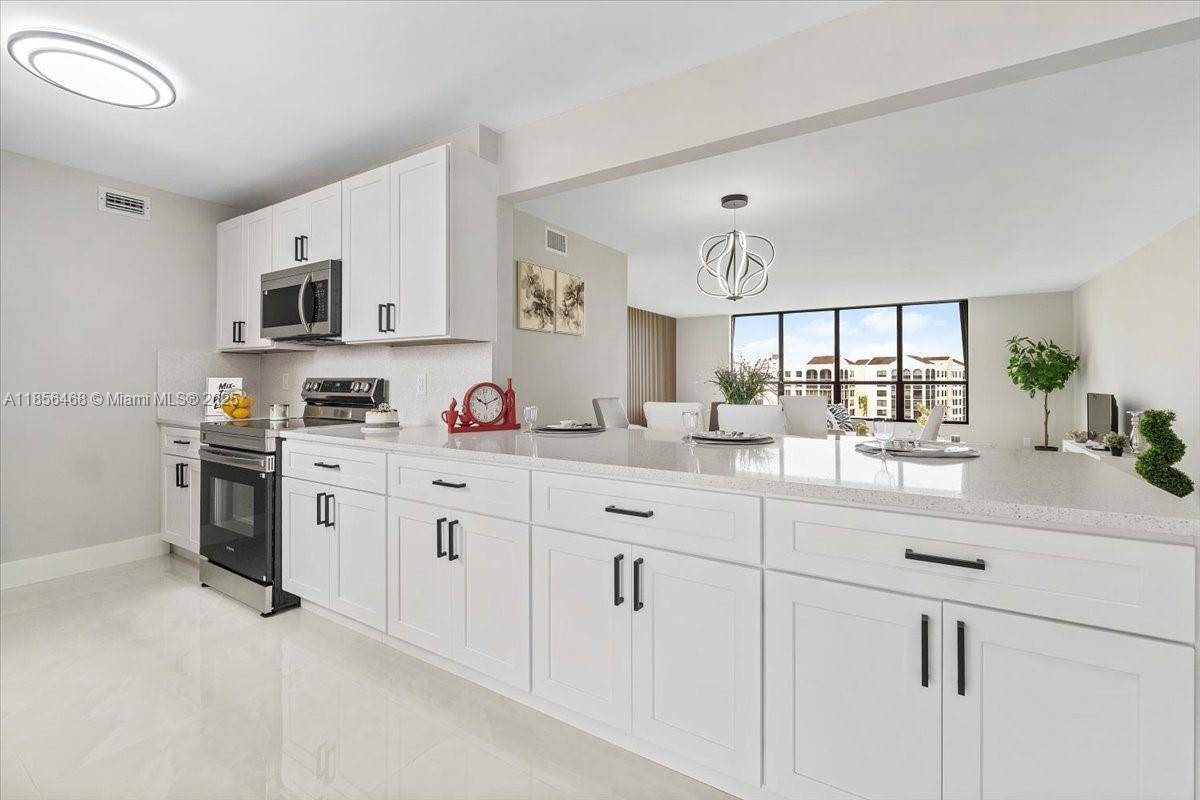 Exquisite 8th Floor Residence with Breathtaking Golf Course Views This fully renovated 3 bedroom, 2 bath gem combines timeless elegance with modern luxury.