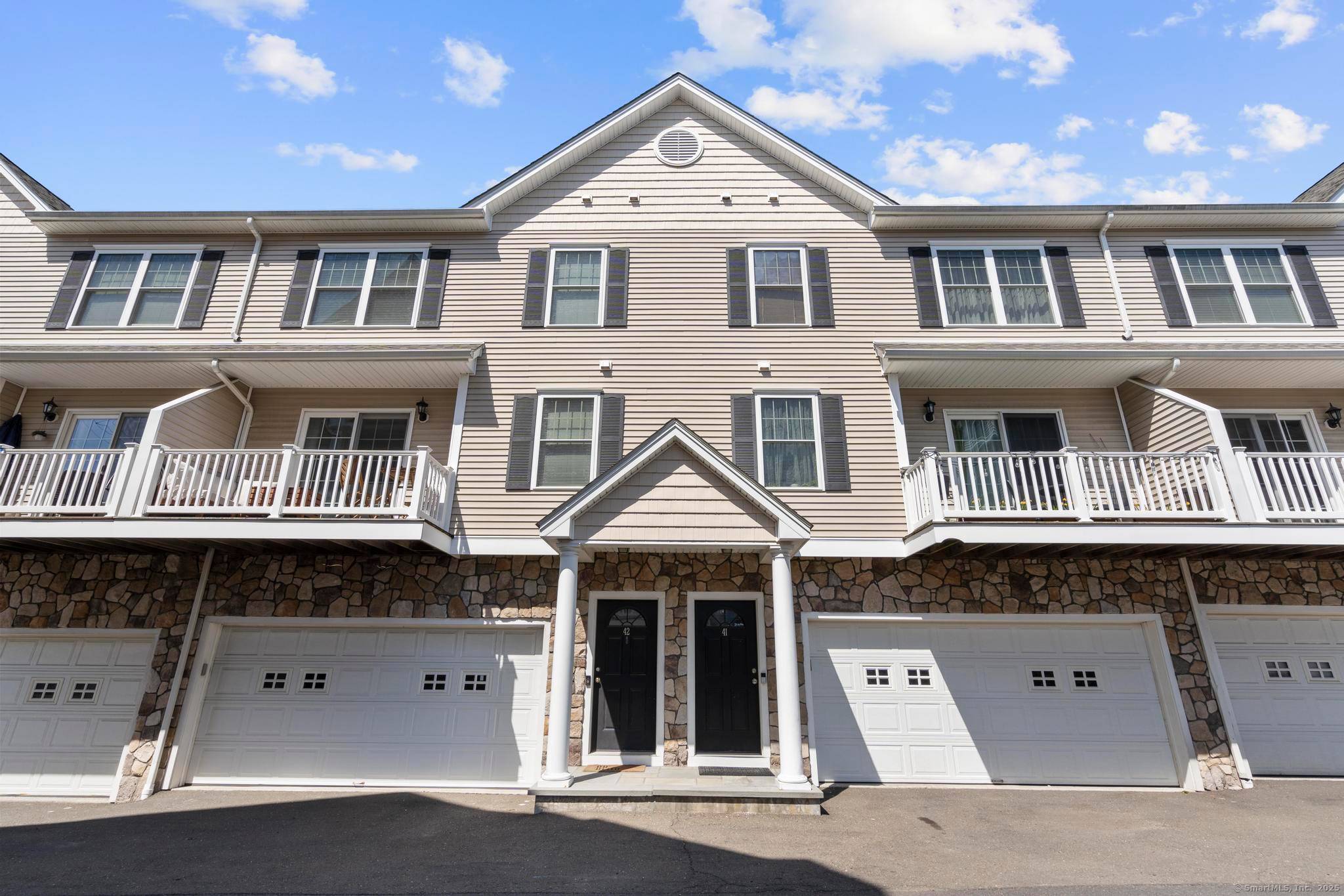 This beautiful move in ready townhome features custom paneling, crown moldings, and hardwood floors throughout.