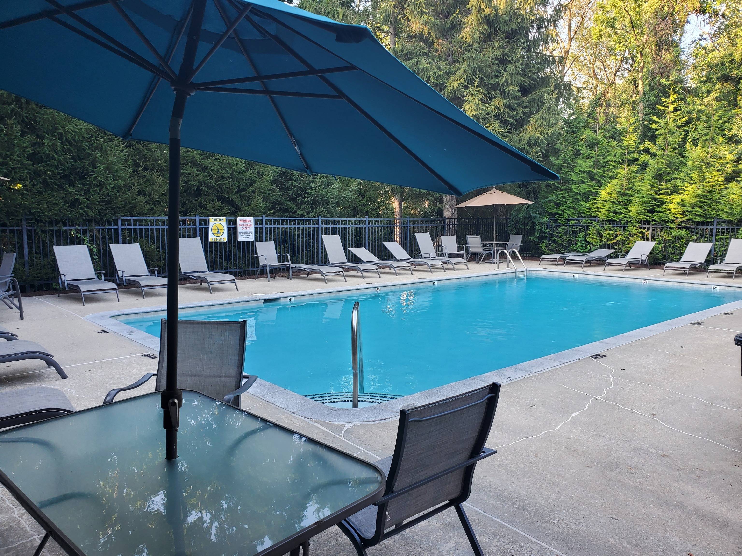 Welcome to maintenance free living in Strawberry Woods one of Stamford's most sought after private communities.