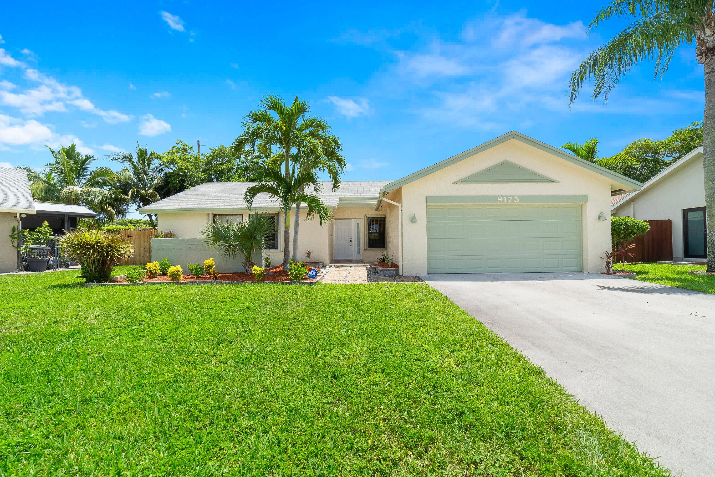 Spacious 4 bedroom, 2 bath single family home in American Homes at Boca Raton with a large 2 car garage and a smart split bedroom layout.