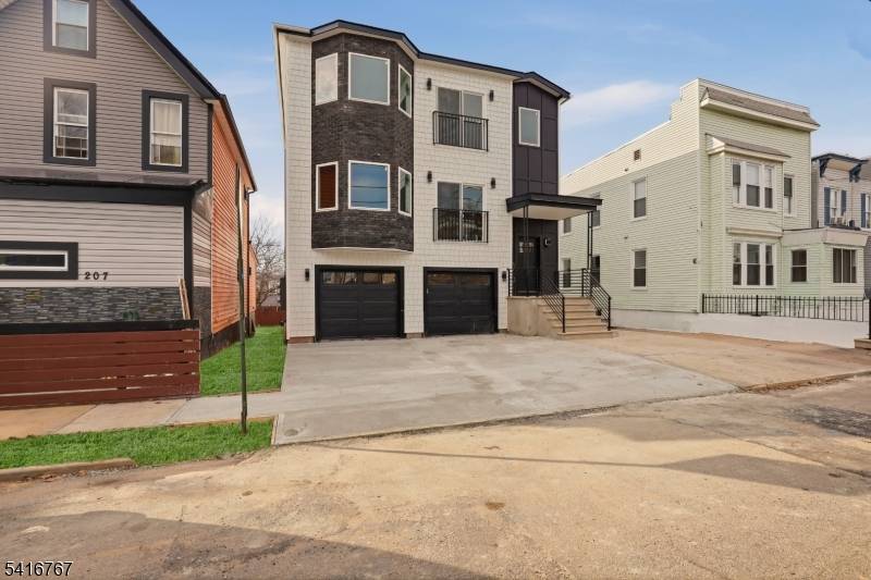 Brand new oversized 32 ft wide legal 2 family just steps from Irvington Park !