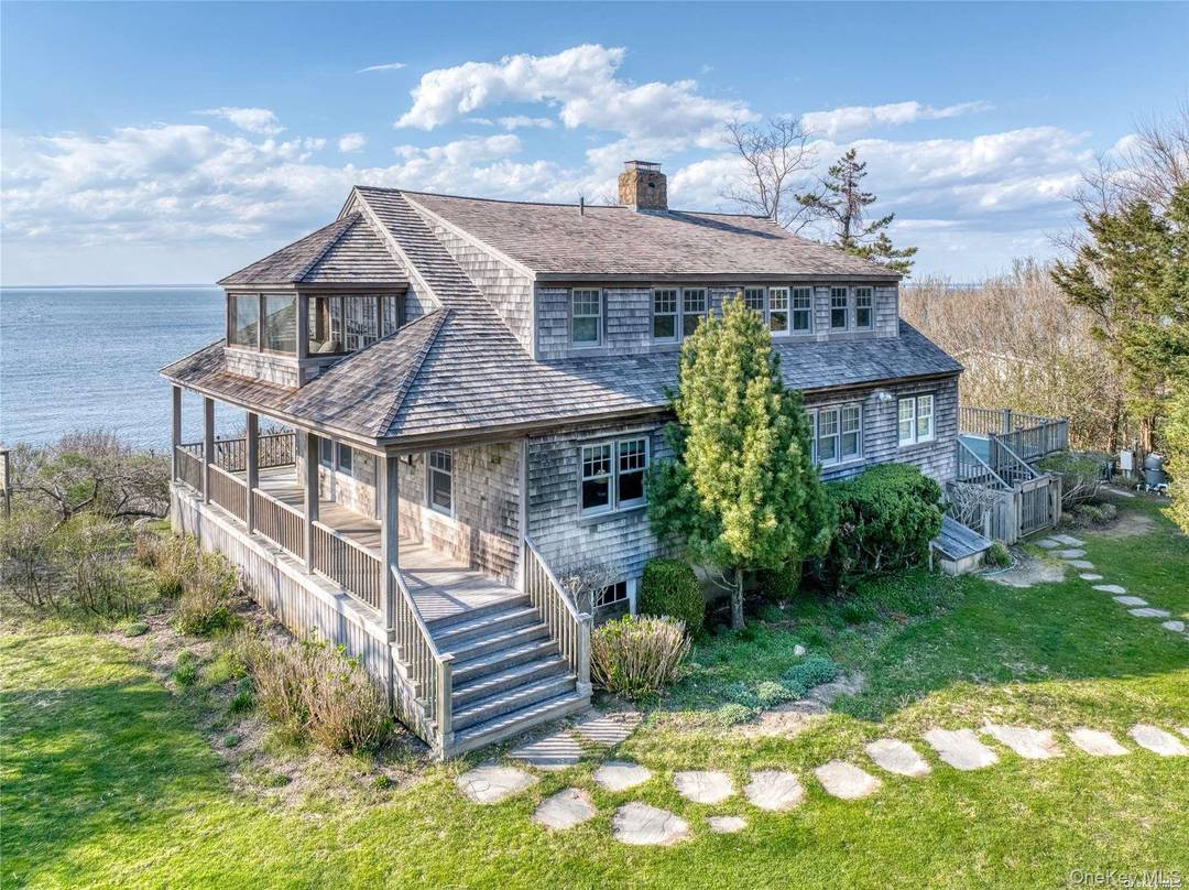 Stunning waterfront shingle style home overlooking Long Island Sound with private beach access.