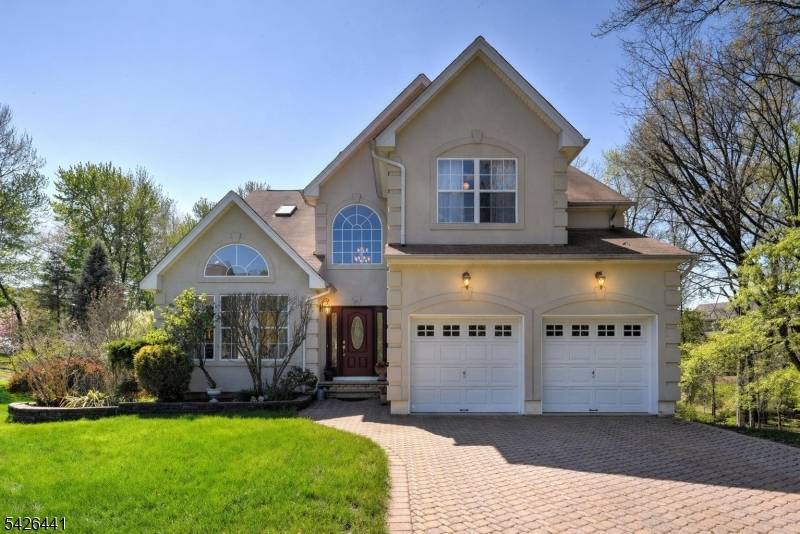 Stately immaculate Colonial nestled in the perfect cul de sac location, features new 2 zone Furnace A C 2022, Tankless On Demand hot water system 2022, underground sprinklers, paver driveway, ...