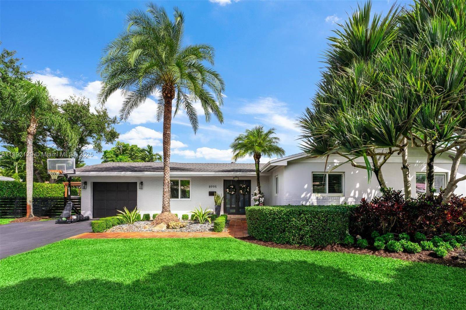 Nestled on a quiet street in the highly sought after Kendallwood neighborhood, this stunning family residence offers a blend of elegance, comfort, and modern convenience.