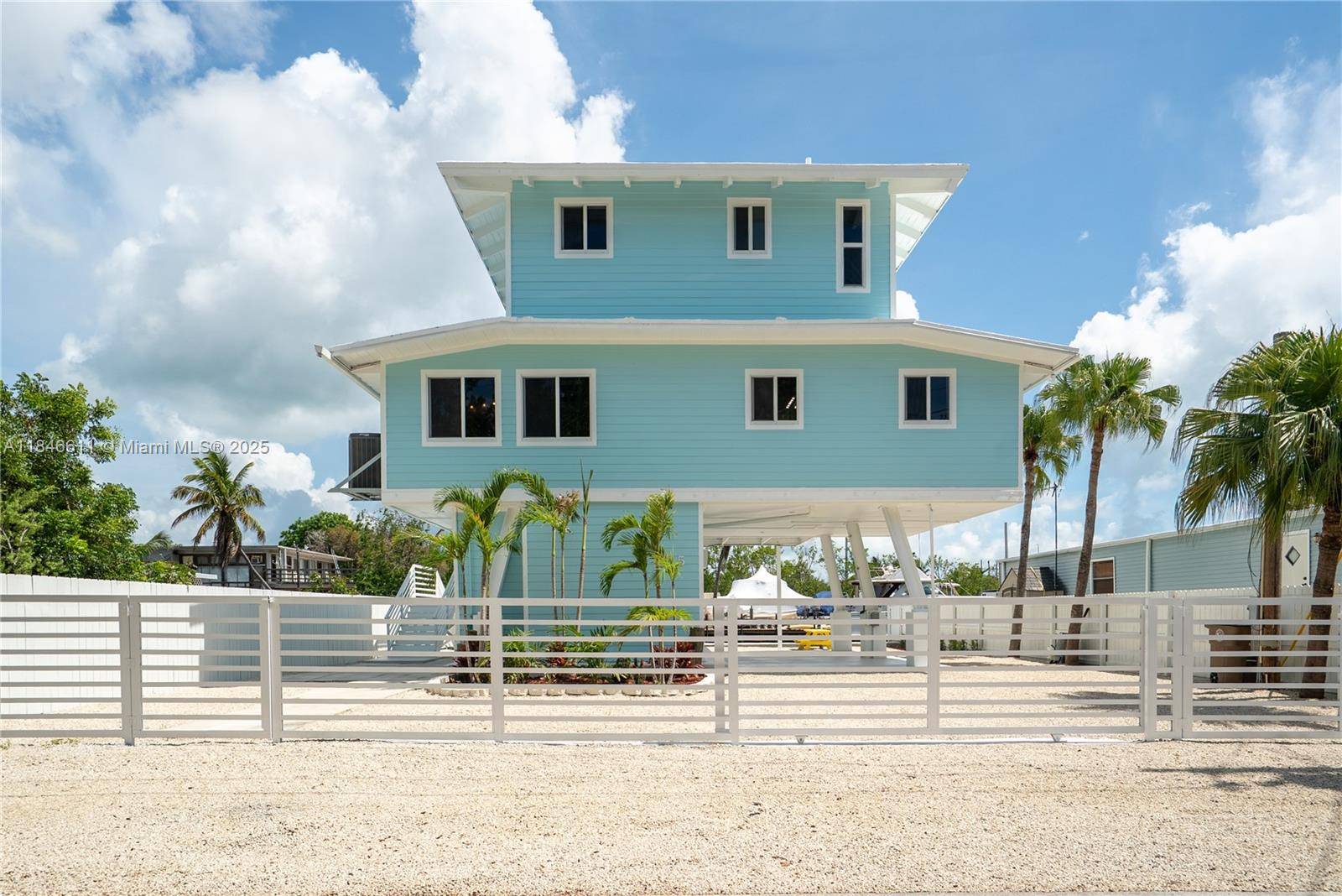 Waterfront Island Bungalow with 60' of Deep Water Dock on a wide canal with direct Bay Access.